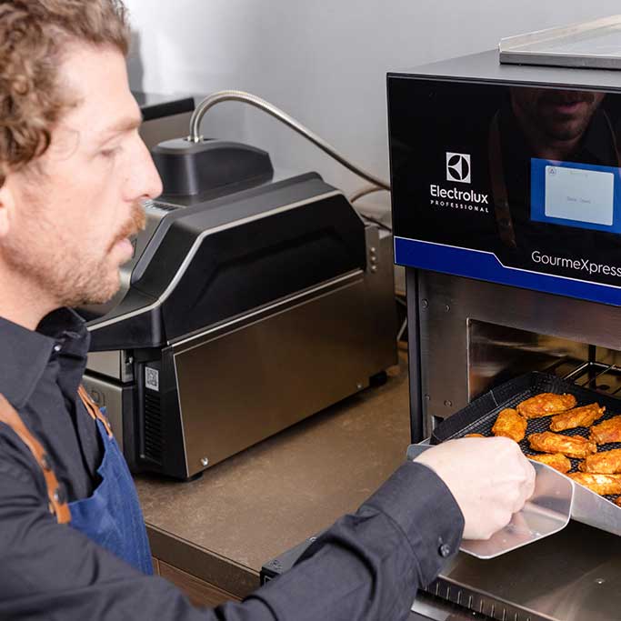 chef using High Speed Oven chef using High Speed Oven